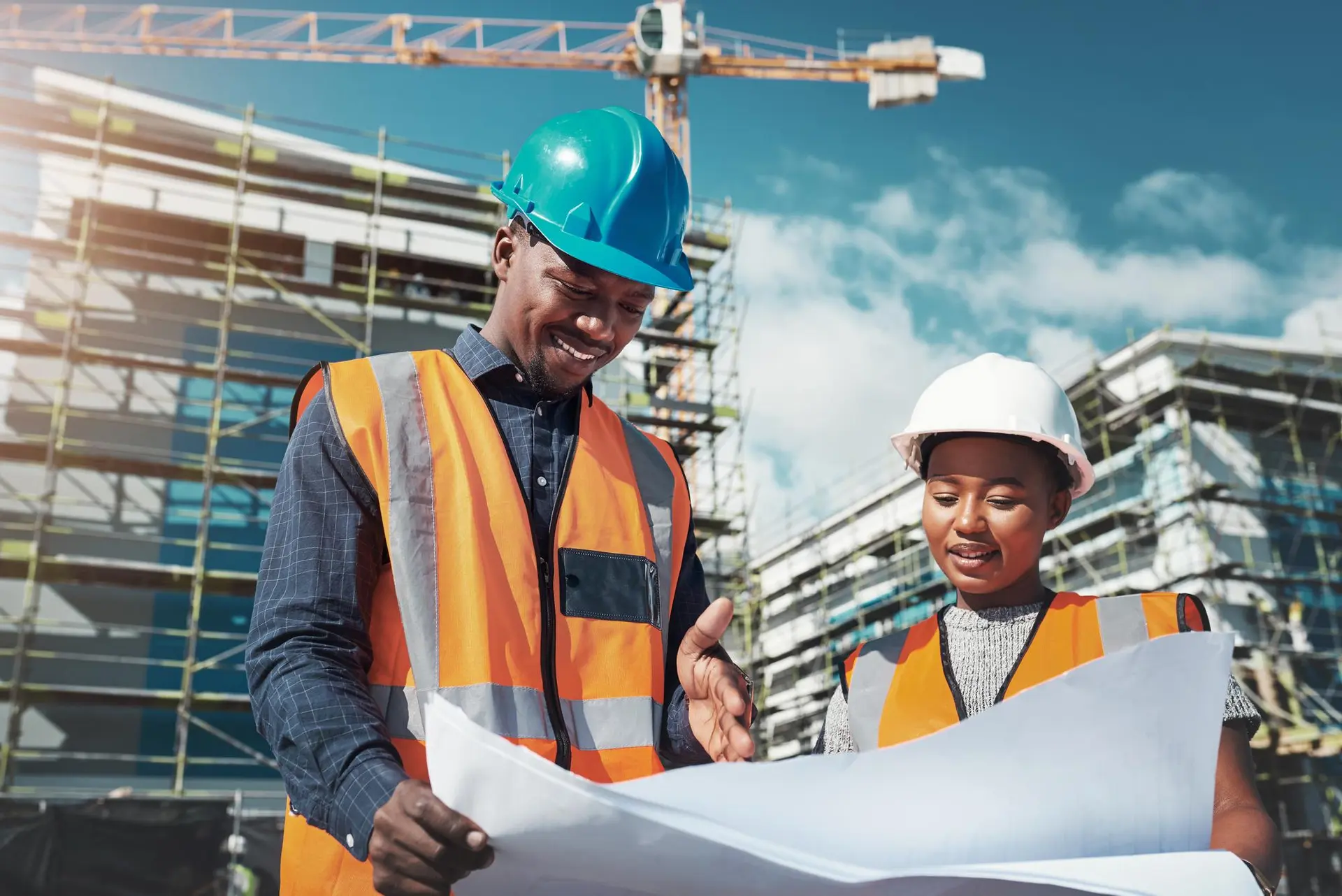 Site engineers reviewing drawings on a construction site